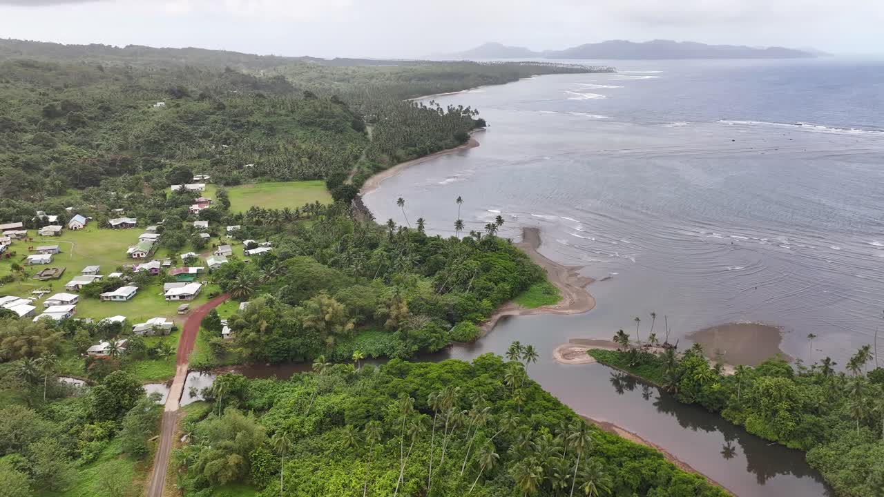 Bouma Coastal Village And Tavoro Creek At Taveuni Island In Fiji. - aerial shot