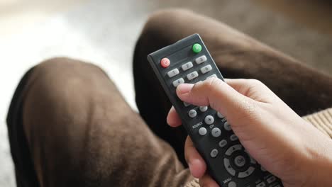 person holding a remote control