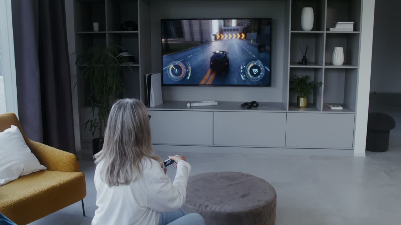 Woman playing video games on TV