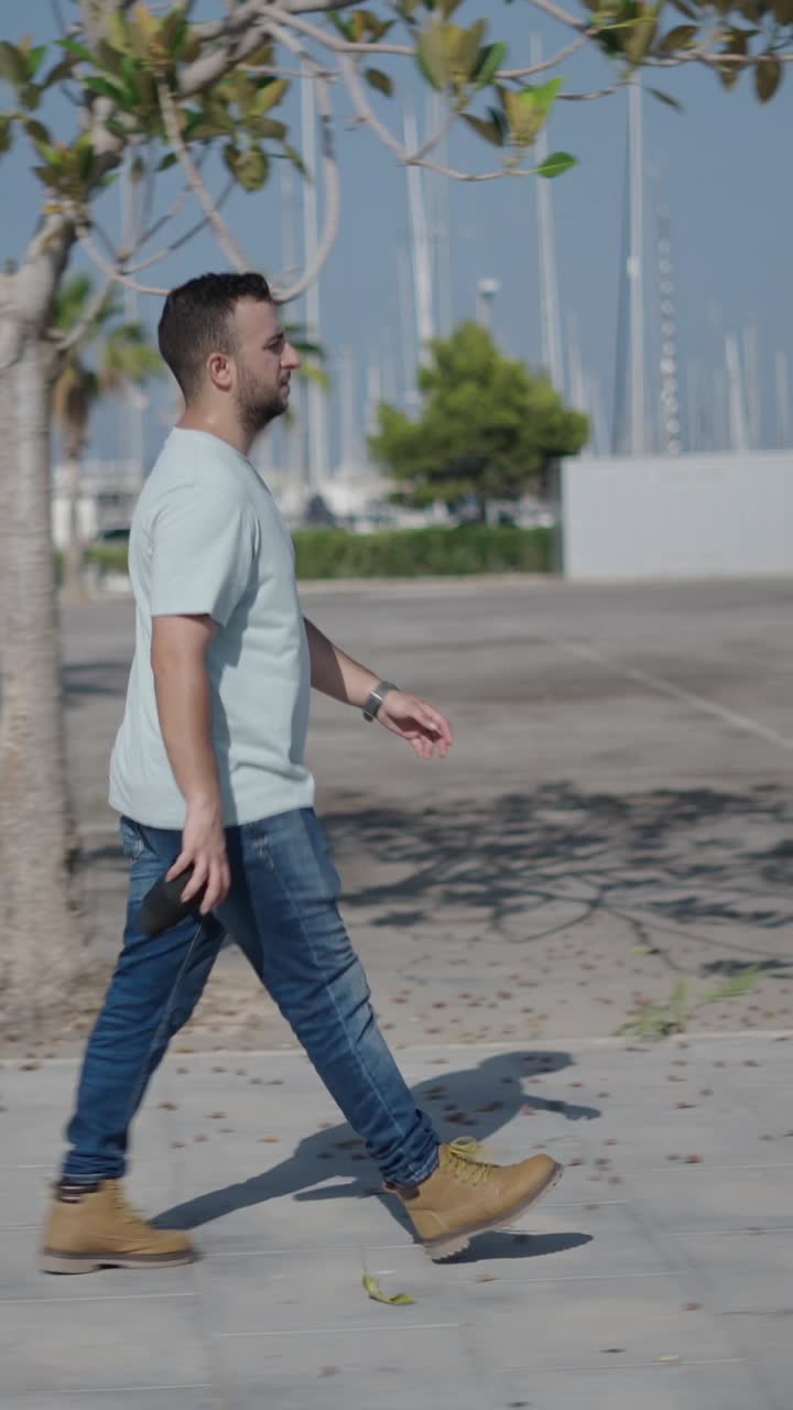 Man Walking in a Marina