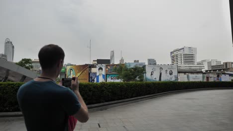 man looking at cityscape in bangkok