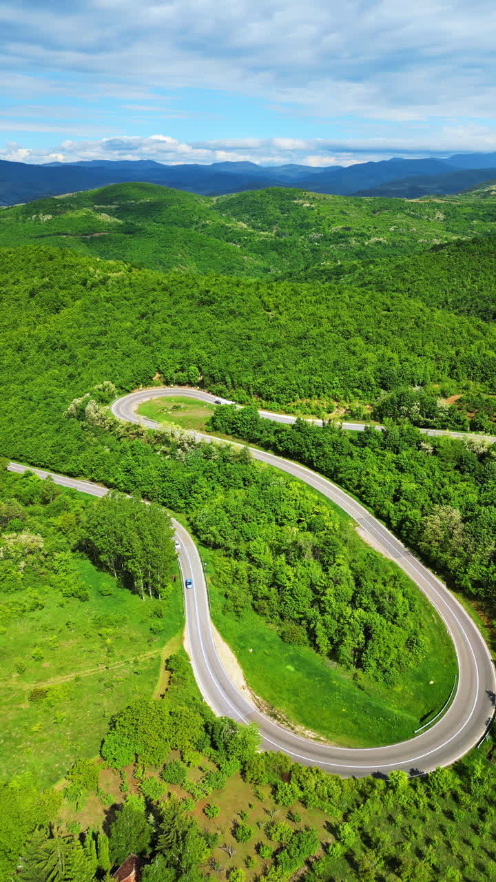 Aerial, drone view of curved road in the mountains in Serbia
