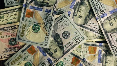 lot of one hundred of dollar bills. one hundred dollars pile as background