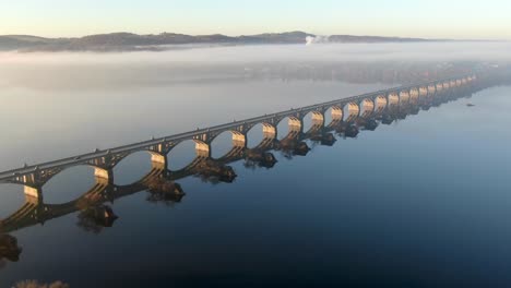 aerial of susquehanna river bridge between lancaster county and york, pa, usa during morning fog and light