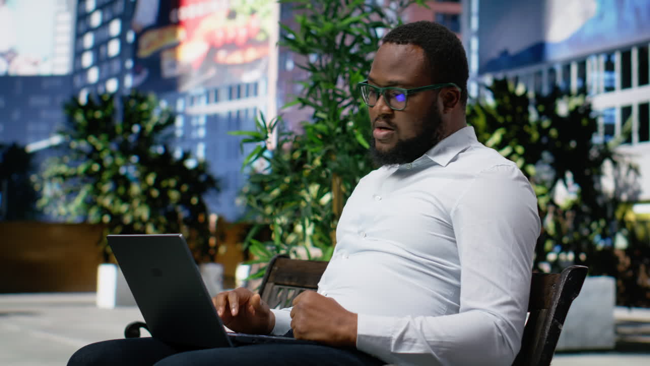 African american person frustrated and distressed working online from a bench