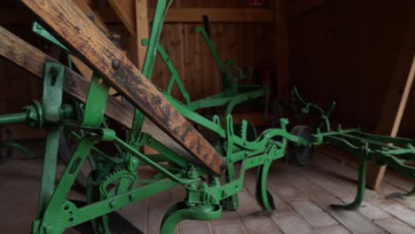 restored vintage agricultural equipment in barn, pan