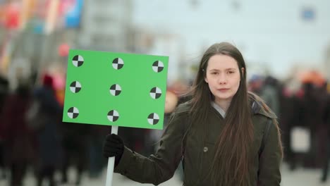 serious girl with blank poster copyspace. empty banner. placard copy space.