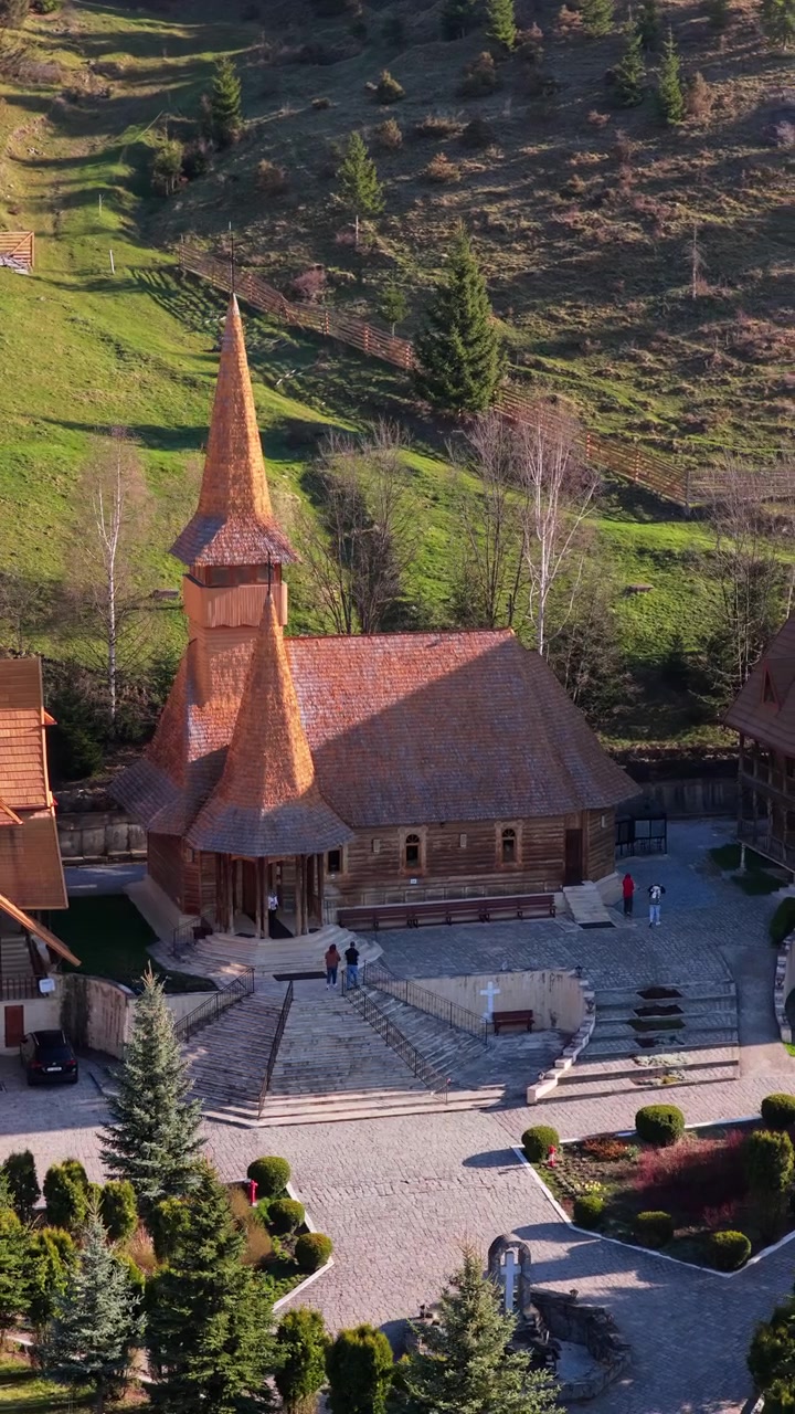 Aerial drone view of the Monastery Acoperamantul Maicii Domnului in Dorna Arini, Suceava County, Romania. Vertical