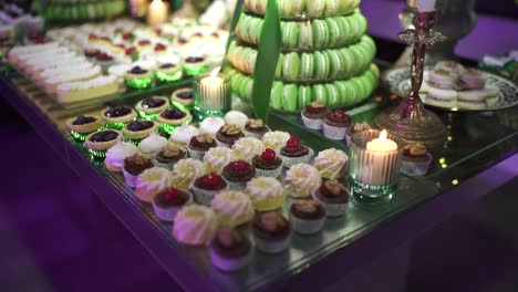 table full of different sweet desserts at business event banquet