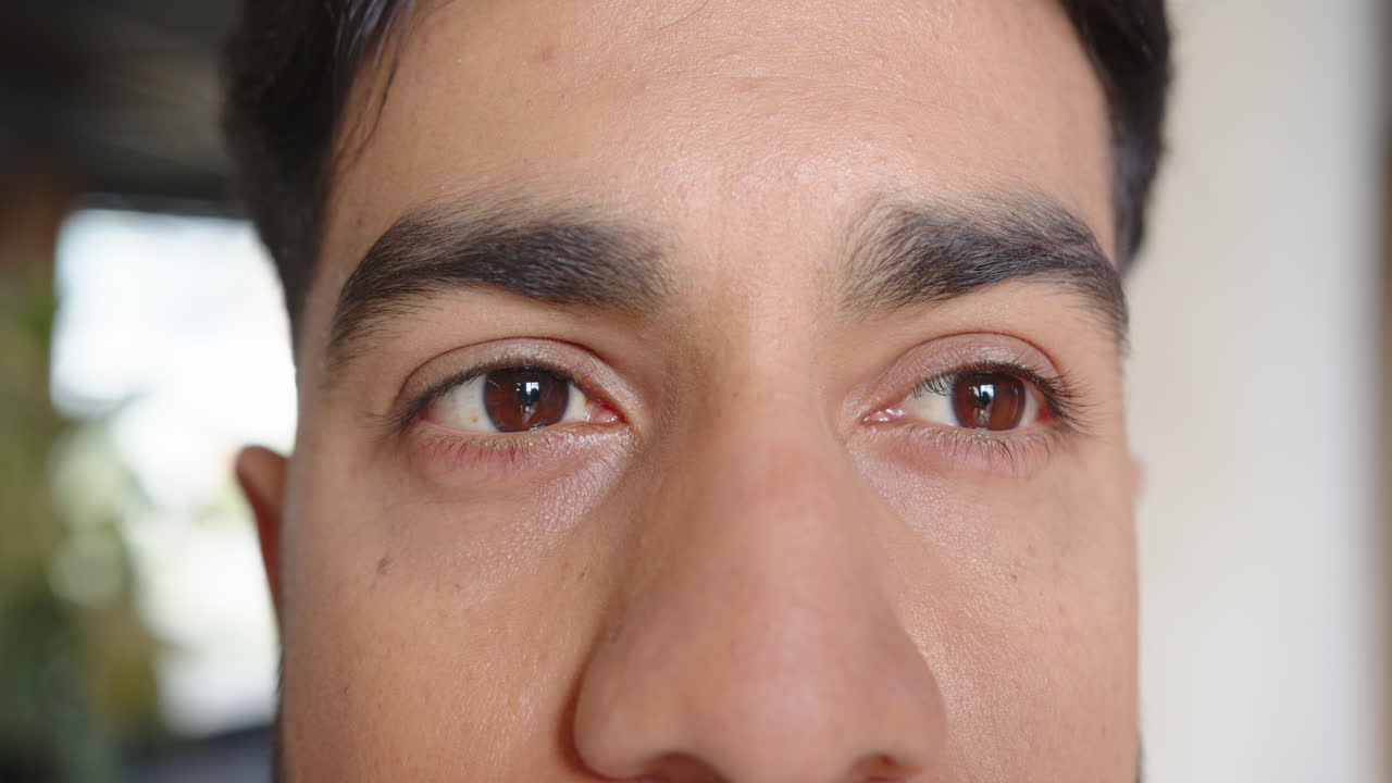 Close-up of man eyes, focusing intently, showing determination and concentration