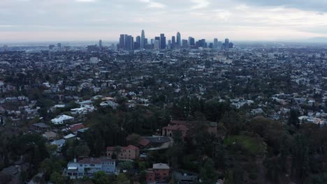 low aerial descending shot of the historic paramour mansion during low light in hollywood, california. 4k