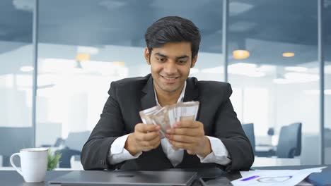 Indian-businessman-with-attitude-counting-the-money