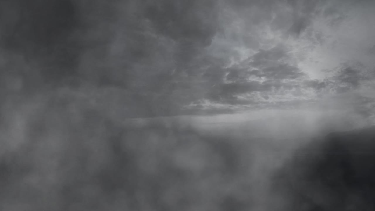 through gray clouds and lightning storms