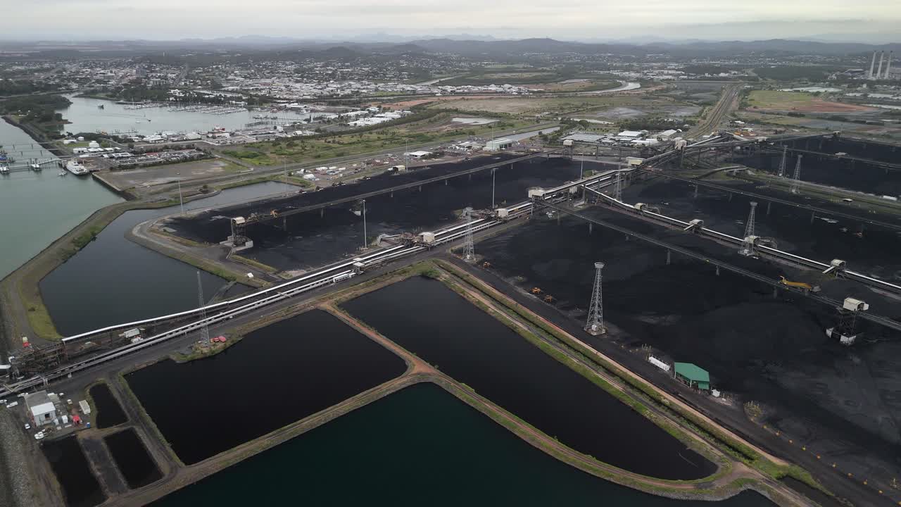Aerial approaches Gladstone coal terminal on Permian Pt in Australia