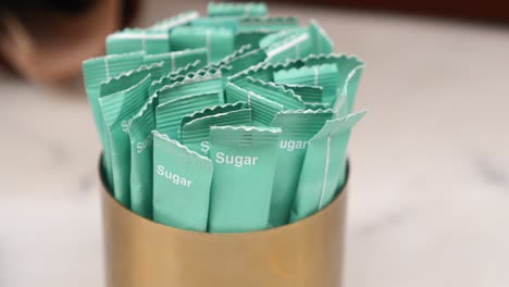 closeup of sugar packets on a table