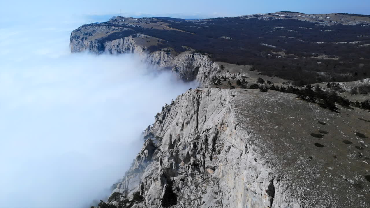 Mountain landscape with fog and cliffs
