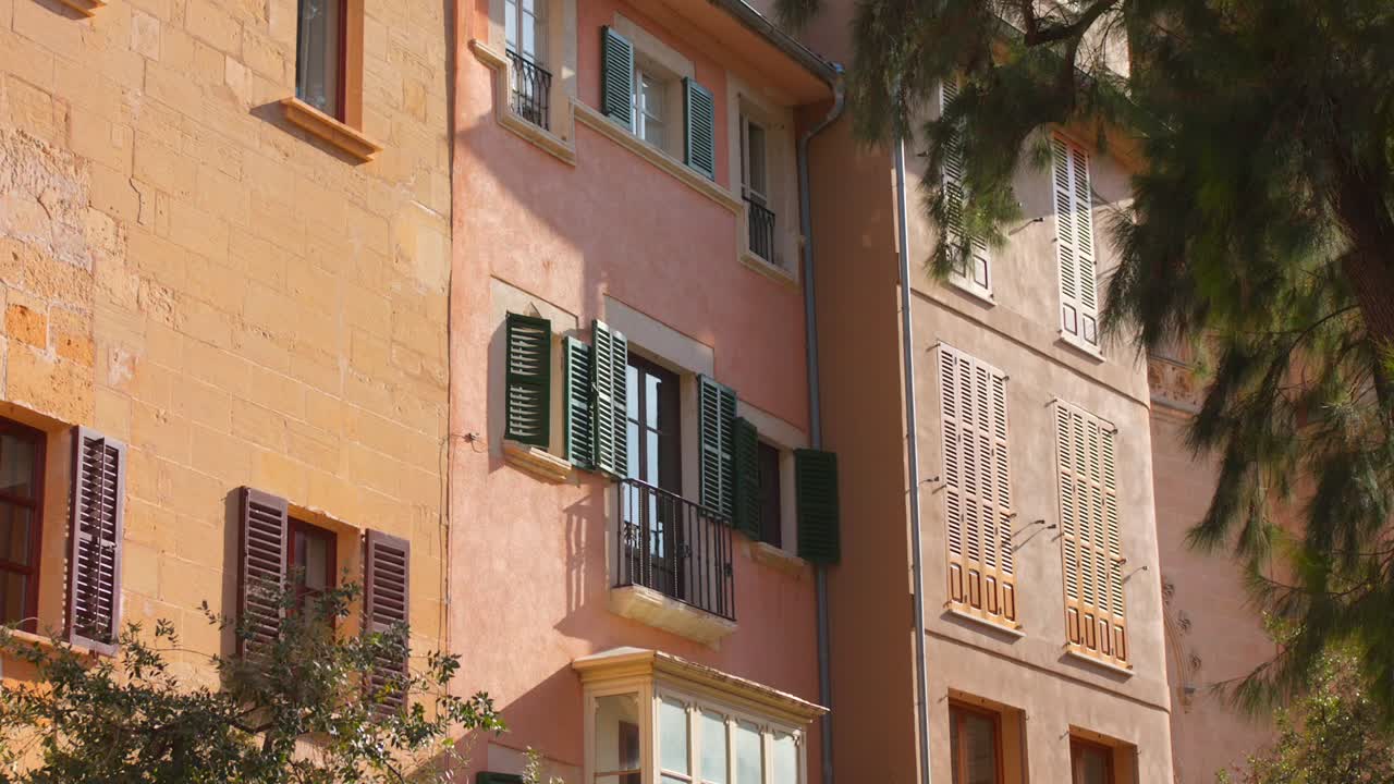 Street Scene With Traditional Residential Buildings In The Old Town Of Palma de Mallorca In Spain. Tracking Shot
