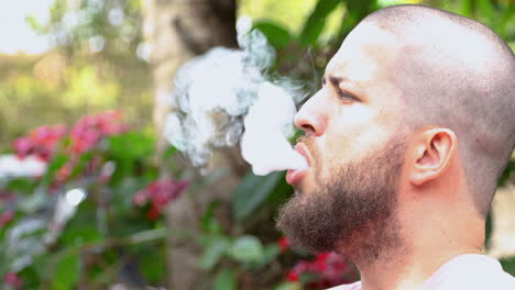 Bearded-bald-man-smoking-vape