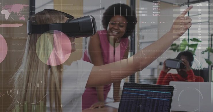 Woman putting on VR headset at office launching data overlays and tapping charts with peers guiding