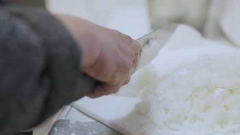 Chopping-white-onions-in-the-kitchen,-120fps