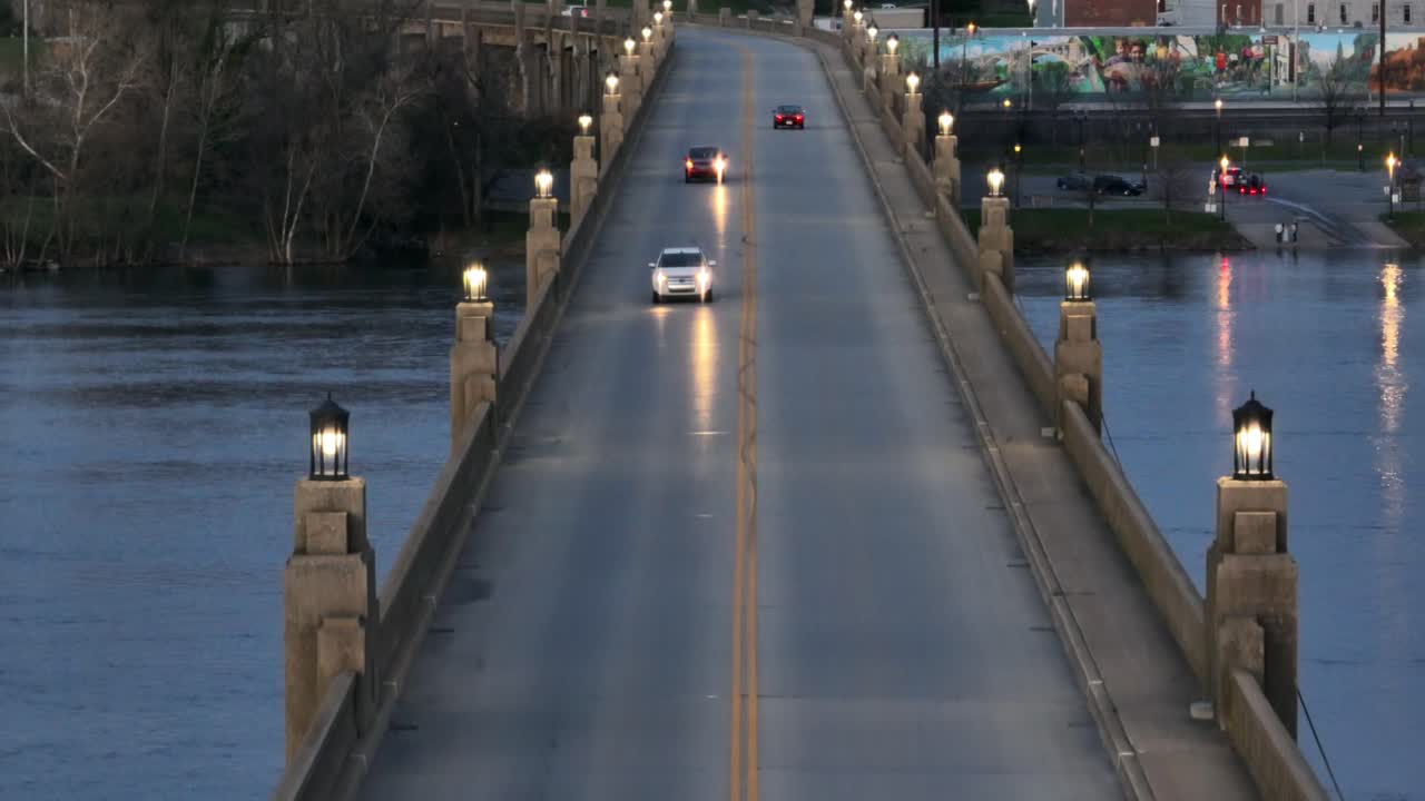Aerial rising shot of traffic on illuminated Columbia&ndash;Wrightsville Bridge during dusk in America,USA