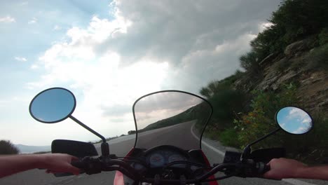 riding a motorcycle on penteli mountain in greece