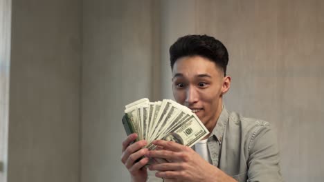 lucky asian man wins lottery taking away big amount of money