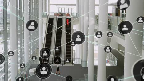 Animation-of-network-of-connections-with-icons-over-escalator-in-office