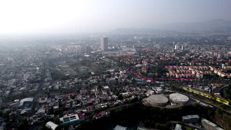 drone video of the unam asphalt plant and quarry in mexico city during a day with highly polluted air