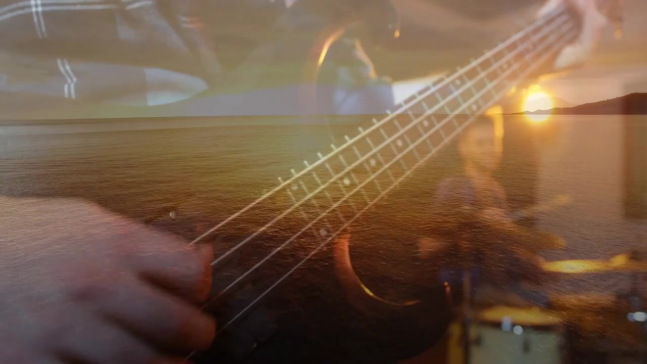Drummer striking sticks starting bass playing lines while ocean dusk overlay drifting for warm mood