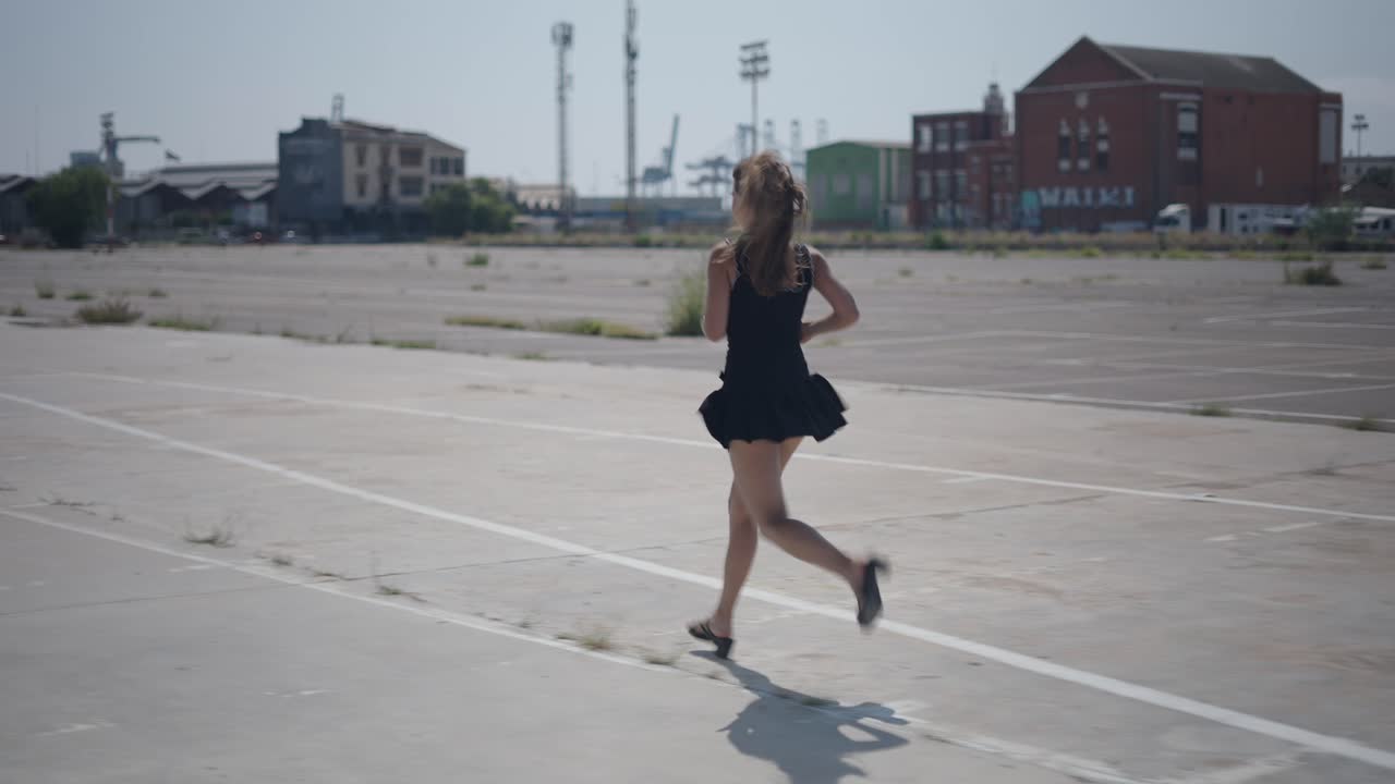 Woman Running in Urban Parking Lot