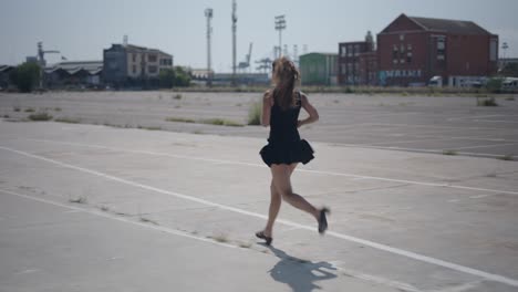 woman running in urban parking lot