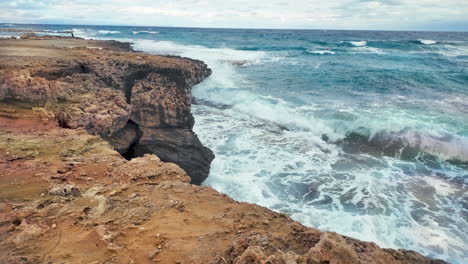 A-view-of-the-rugged-coastal-cliffs-of-Cyprus-with-waves-crashing-against-them