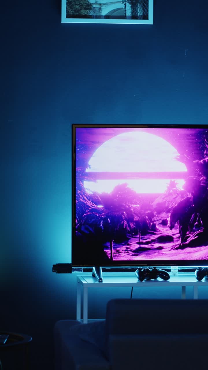 Vertical video TV screen showing 3D render animations in empty stylish neon lit home studio interior