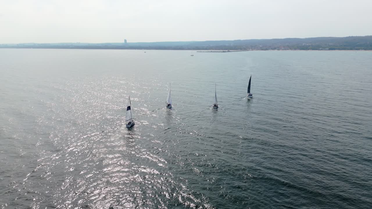 Four sailboats on restful calm waves of Baltic Sea, Gdansk Bay, Poland aerial panorama