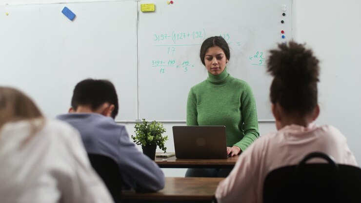 Teacher and students at school