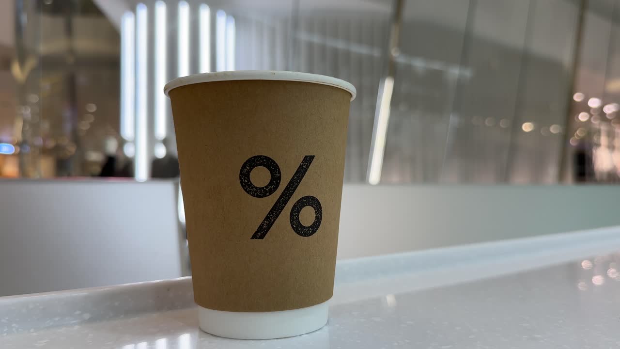 'Percentage' Sign Coffee Cup IconSiam Shopping Centre, Bangkok, Thailand - middle left frame