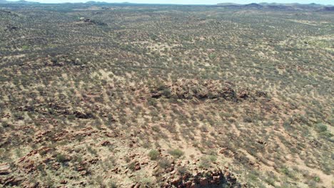 drone view of the dry rocky landscape north of alice springs, mparntwe. northern territory, australia. august 2022.