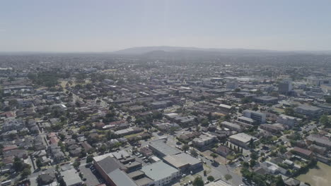 sideways aerial pan over grater city of dandenong on clear summers day