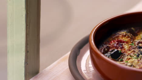 aubergine, feta and tomato bake in earthenware dish, pan