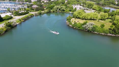 aerial shot flying towards a boat on lake ontario near toronto in the summer