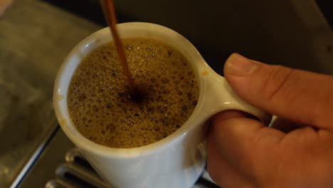 coffee mug filled up in the kitchen of an old school diner