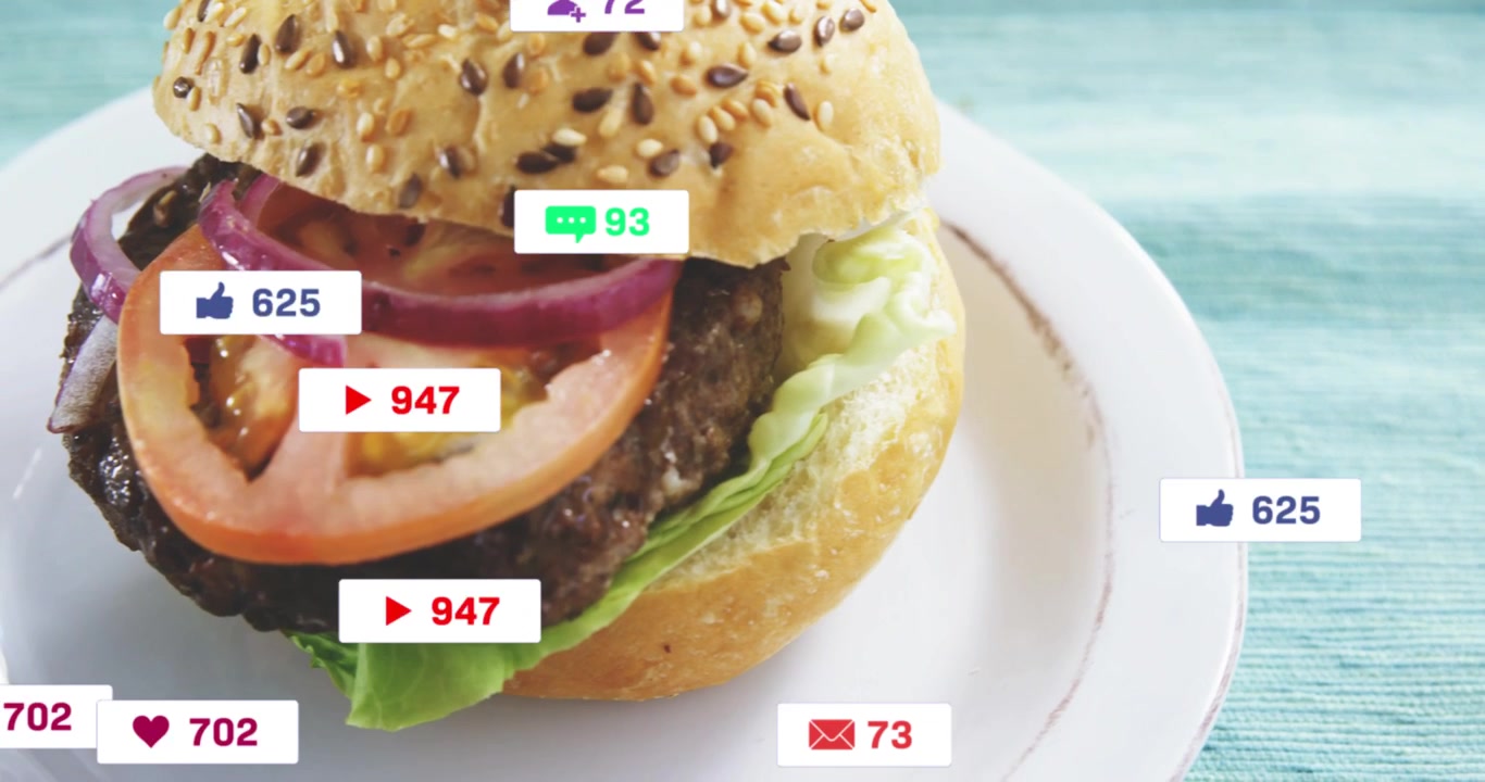 Left-edge crop shifting, camera revealing burger while badges counting up to drive engagement