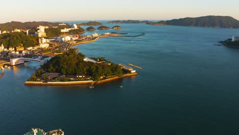 toba bay and mikimoto pearl island aerial reveal shot at sunrise 4k