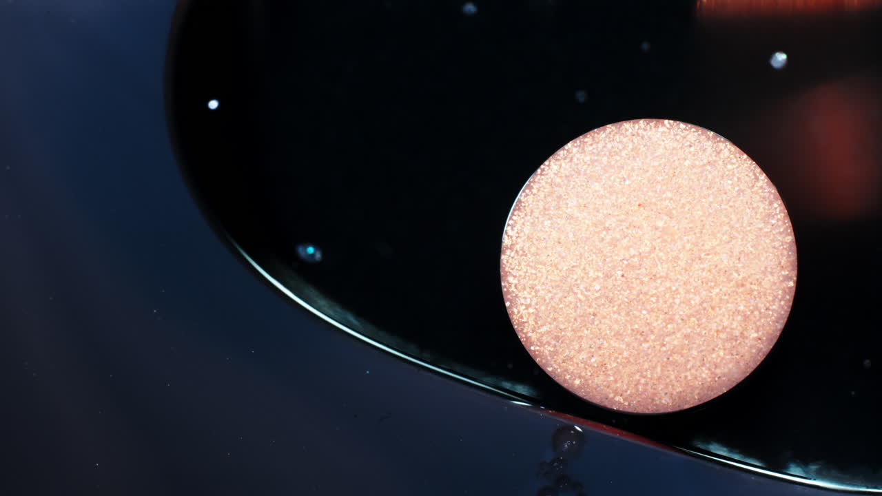 Effervescent tablet dissolving in liquid, macro shot shows details of bubbles and textures