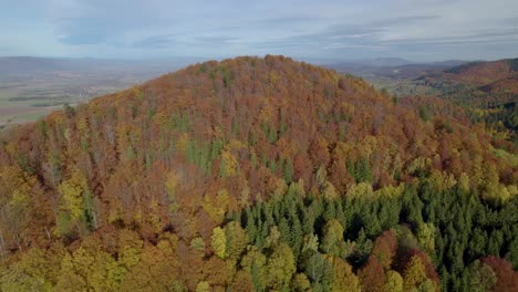 aerial establishing shot of the autumn-colored mountains in europe