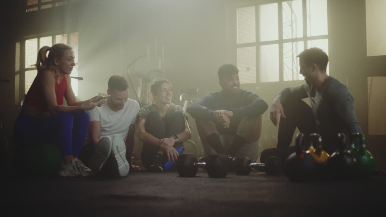 Friends Relaxing and Talking in a Gym