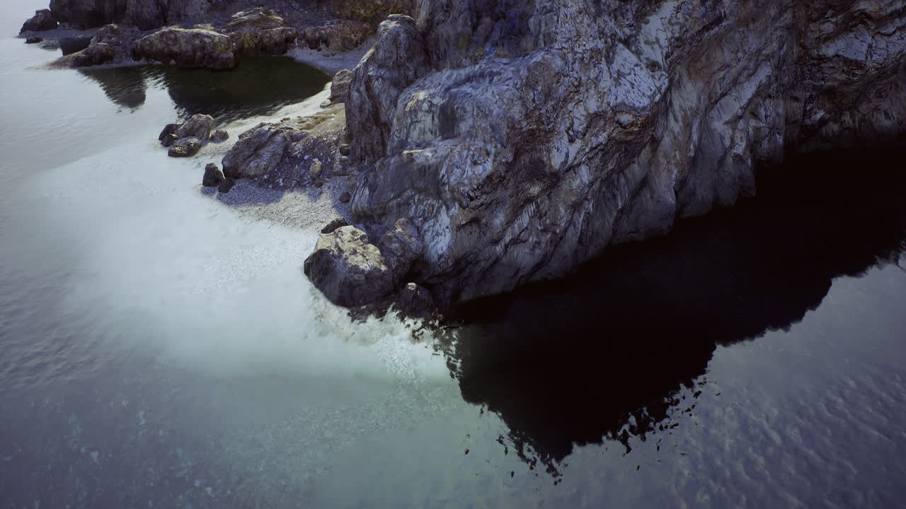 Rocky shoreline with calm waters at a secluded coastal location