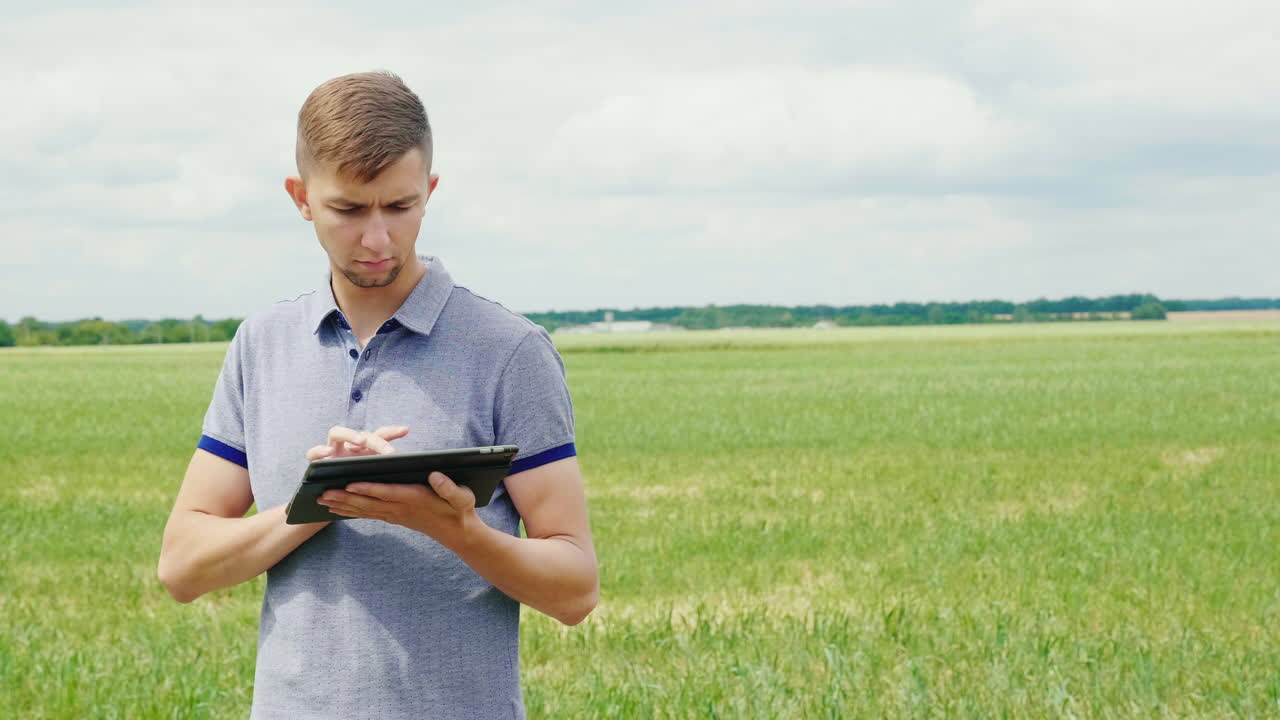 A Young Farmer Is Working Near A Pile Of Compost