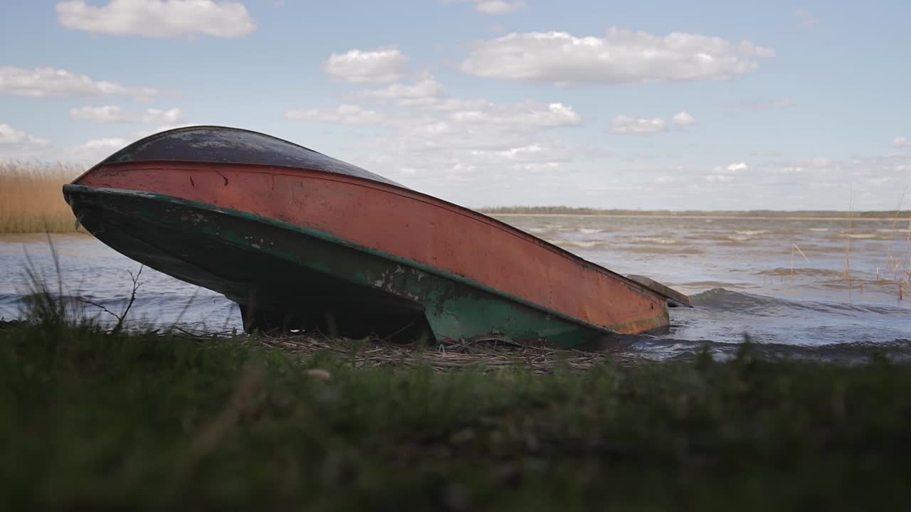 Old Abandoned Boat on the Lake Shore